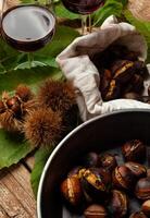 Roasted chestnuts in iron skillet photo