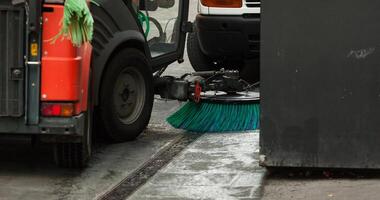 Street sweeper machine cleaning the streets photo