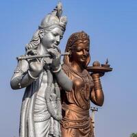 Big statue of Lord Radha Krishna near Delhi International airport, Delhi, India, Lord Krishna and Radha big statue touching sky at main highway Mahipalpur, Delhi photo