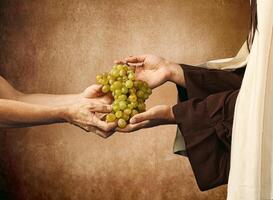 Jesus gives grapes to a beggar photo