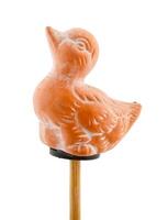 Duck in clay on wooden stick photo