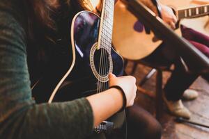 Playing classic guitar. Selective focus. photo