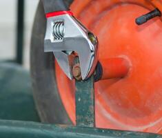 Replacing the tire of a wheelbarrow. photo