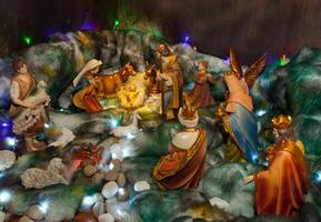 Christmas crib with figures and nativity photo