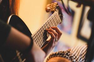 Playing classic guitar. Selective focus. photo