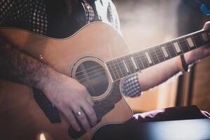 Playing classic guitar. Selective focus. photo