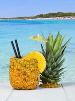 Pineapple juice served in the peel photo