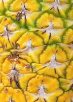 Macro textured background of pineapple photo