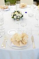 Mise en place of a round table for a wedding event photo