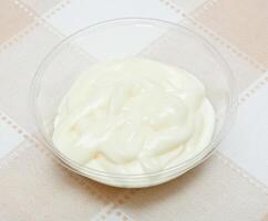 Pot with bechamel sauce photo