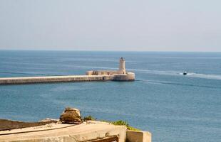 View of lighthouse in Grand Harbour, Valletta, Malta photo