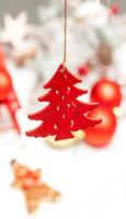 Red wooden Christmas sapling photo