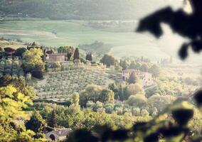 Landscape of Tuscany hills with lens flare photo