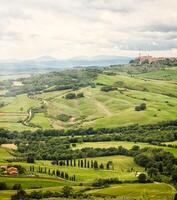 View of the town of Pienza with the typical Tuscan hills photo