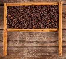 Frame with coffee beans and ceylon cinnamon photo