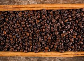 Frame with coffee beans and ceylon cinnamon photo