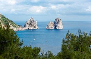 Faraglioni, famous giant rocks, Capri island photo