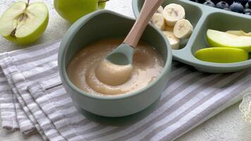 Healthy baby food in bowl. video