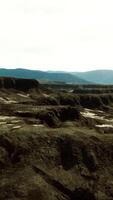 black volcanic basalt rock formations in the low light video