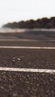 Empty beach car park spaces covered in asphalt. video