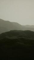 silhouette of swiss alps mountains in morning clouds video