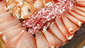Platter of Italian cold cuts, coppa, salami and raw ham. photo