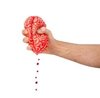 Hand squeezes a rubber brain photo