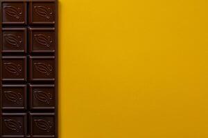 Chocolate bar pieces. Background with chocolate. Sweet food photo concept.