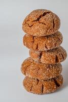 Warm Homemade Gingersnap Cookies on a light background photo