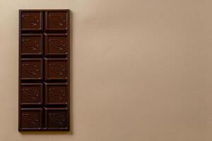 Chocolate bar pieces. Background with chocolate. Sweet food photo concept.