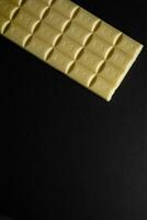 Chocolate bar pieces. Background with chocolate. Sweet food photo concept.