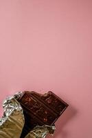 Chocolate bar pieces. Background with chocolate. Sweet food photo concept.