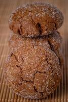 Warm Homemade Gingersnap Cookies on a wooden board photo