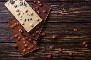 Chocolate bar pieces. Background with chocolate. Sweet food photo concept.