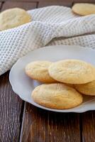 Delicious sugar cookies on wooden table, closeup photo