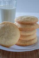 Delicious sugar cookies on wooden table, closeup photo