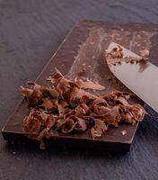 Chocolate bar pieces. Background with chocolate. Sweet food photo concept.