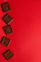 Chocolate bar pieces. Background with chocolate. Sweet food photo concept.