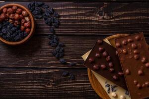 Chocolate bar pieces. Background with chocolate. Sweet food photo concept.