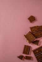 Chocolate bar pieces. Background with chocolate. Sweet food photo concept.