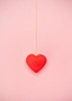 Heart hanging to a string of twine photo