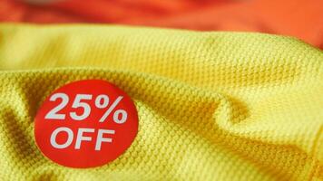 25 discount sakes tag on yellow color cloth video