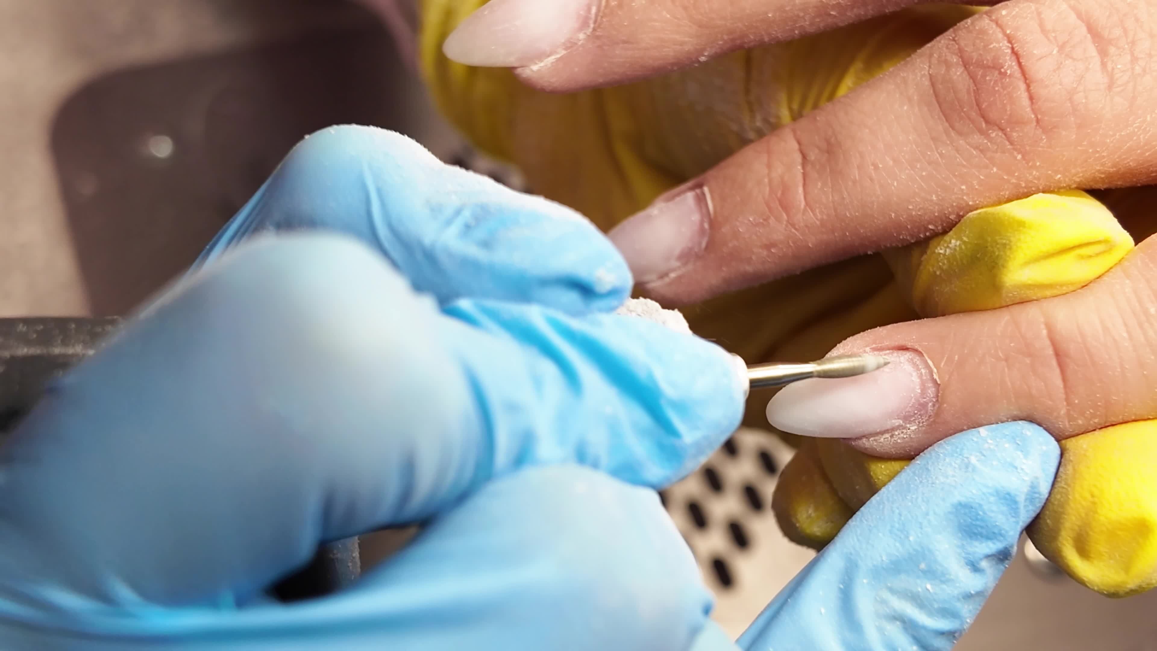 A manicurist cuts the cuticle. 44574727 Stock Video at Vecteezy