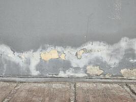 Peeling wall paint is caused by moisture and mold. photo