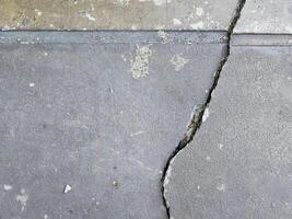 Cracked floor concrete broken and collapsed wall that effected with earthquake and collapsed ground photo