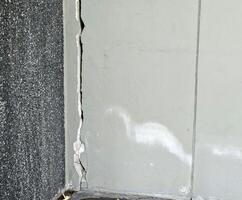 Cracks or collapse of building columns are caused by earthquakes. photo