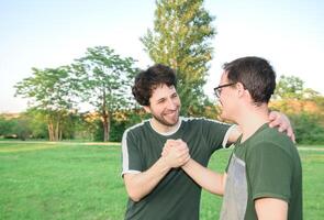 Two friends high-fives happily after working out photo