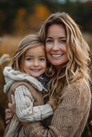 A woman and a little girl ,holding and playing with her daughter , Mother's day photo