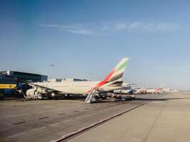 Afines, Greece - 20 august 2023. Passenger plane with a gangway stands near the airport. Back view photo