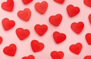 Flat view of valentines hearts on pink background photo